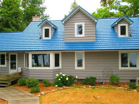 red house with blue metal roof|houses with blue shingle roofs.